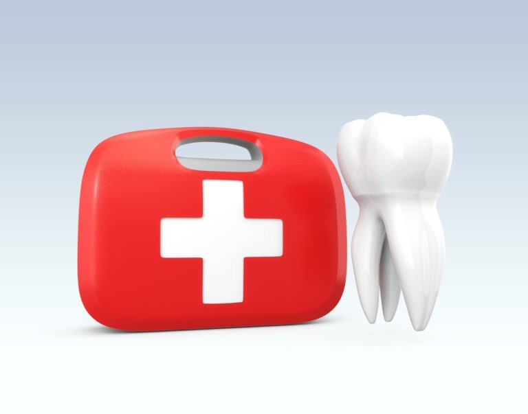 A red first aid kit with a white tooth beside it