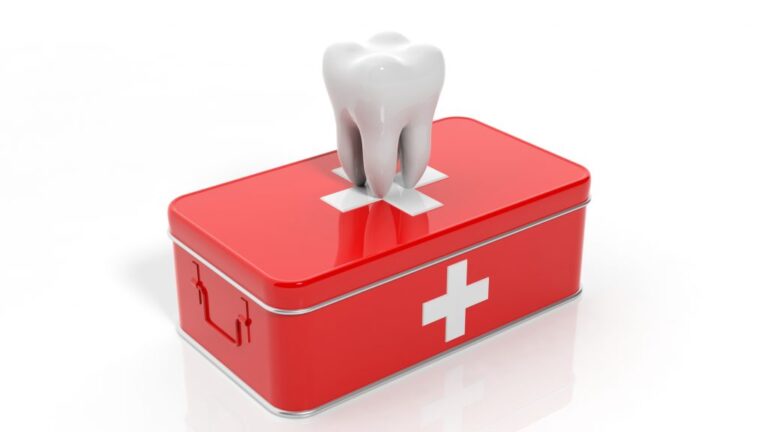 Image of a tooth on top of a medical first aid box, symbolizing a dental emergency.